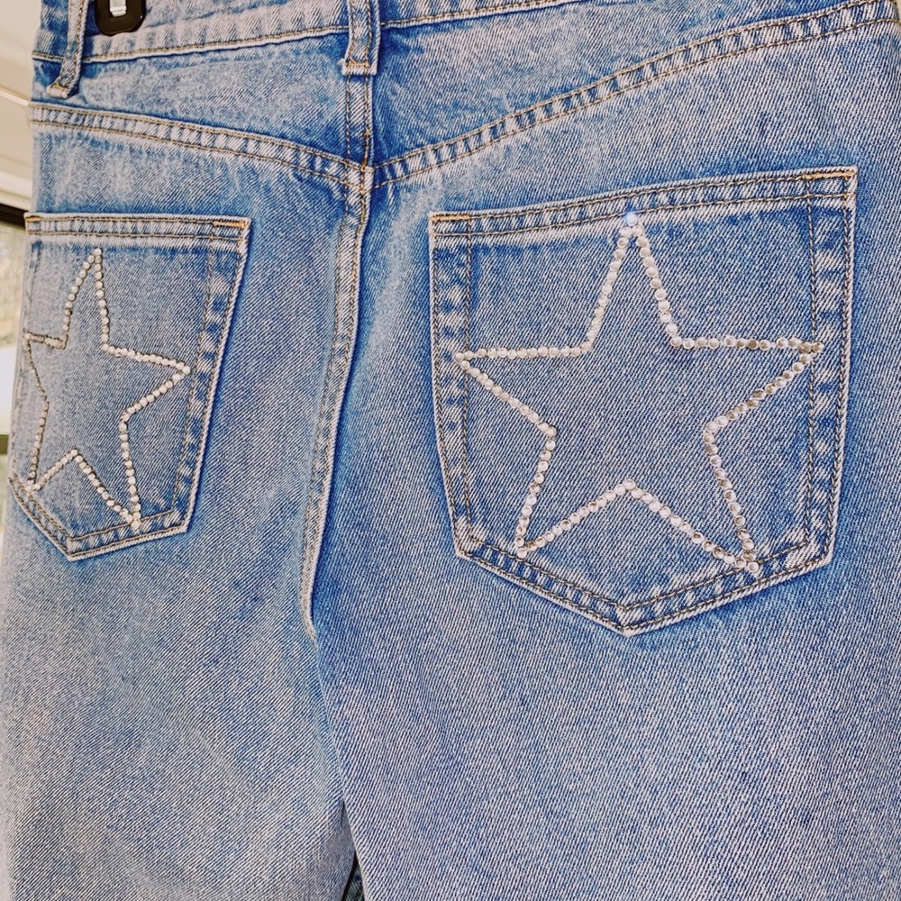 ripped jeans with sparkle star on back